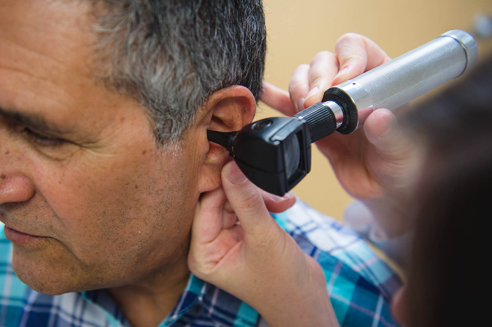 ENT specialist treating a perforated eardrum at Scottsdale Ear, Nose & Throat